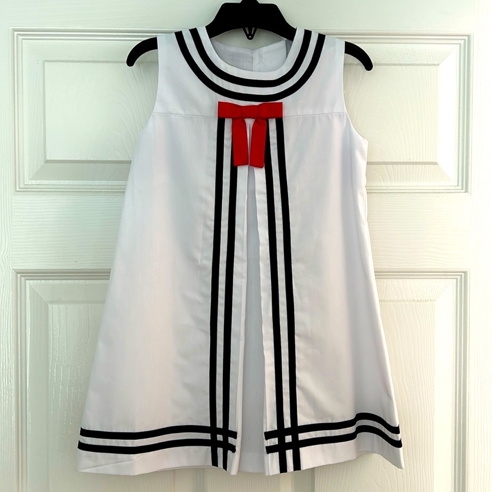 White Beaufort Bonnet Co dress with navy and red details.